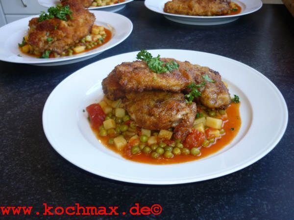 Schnitzelchen auf Tomaten-Erbsen-Kartoffel-Gemüse